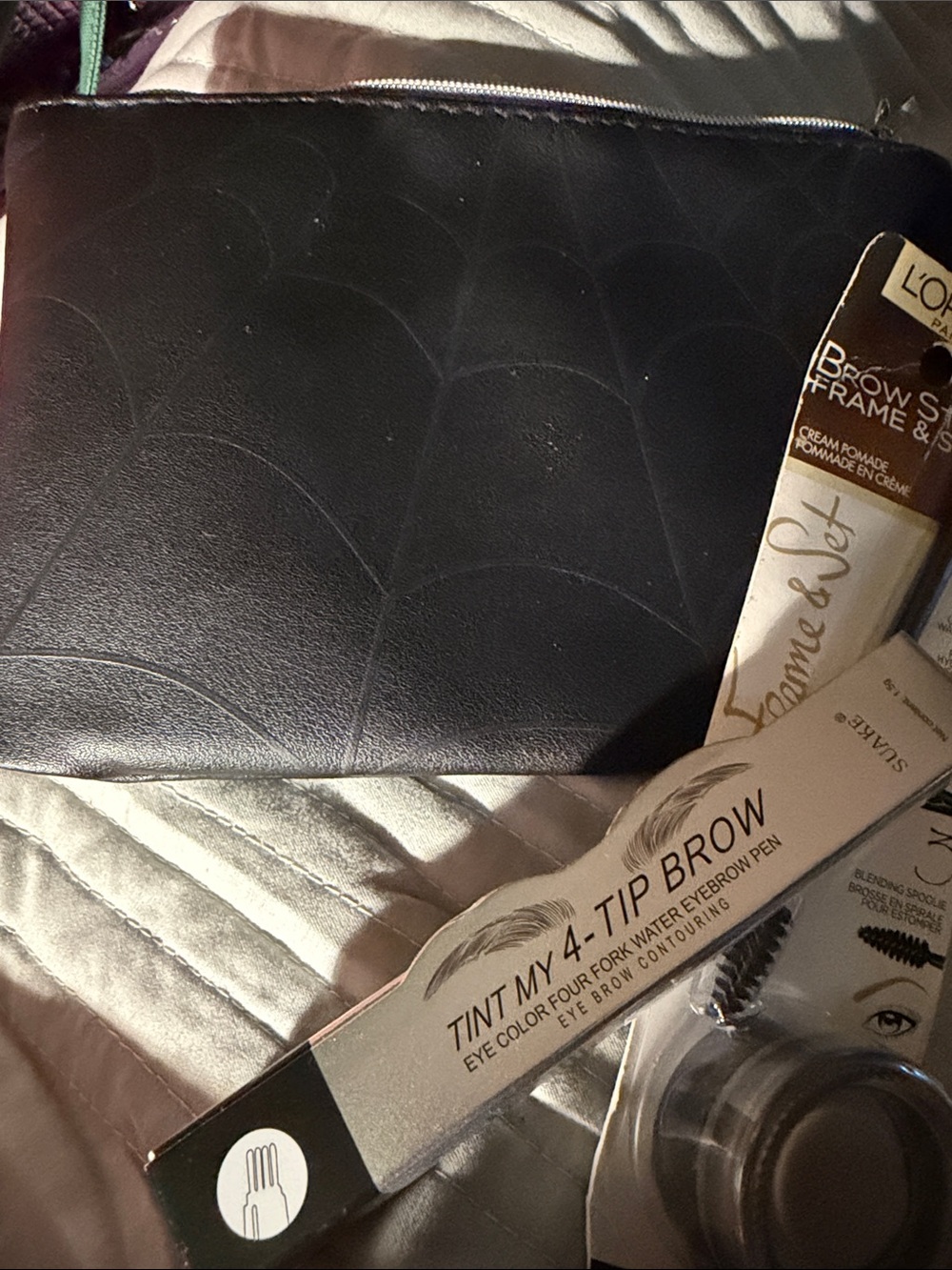 ipsy Black Faux Leather Cosmetic Pouch with Silver Logo with brow makeup